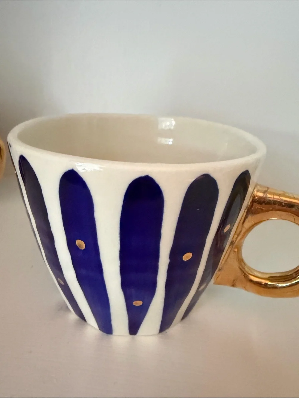 Anthropologie Hand-Painted Navy Stripe Ceramic Cup with Gold Handle